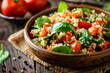 Tomato quinoa salad with red pepper and spinach portion