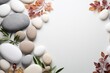 Balanced stones with autumn leaves on a white background