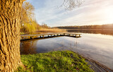 Fototapeta  - Scenic sunset with a pier on a lake near the town of Recz, West Pomeranian Voivodeship, Poland.