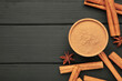 Cinnamon sticks on a wooden background. Cinnamon spice in bowl. Ceylon cinnamon.