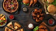 takeout favorites like pizza, chicken wings, and burgers laid out on a dark wooden table in an overhead shot, showcasing the tempting spread from a top-down flat lay perspective.
