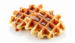 Top view of Belgian waffles with caramel sauce on white background