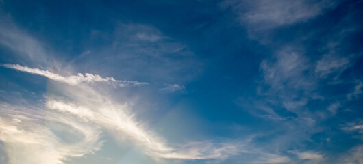 Wall Mural - sunset sky with clouds and bright light. Wide photo.