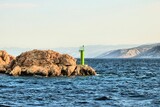 Fototapeta Na drzwi - green lighthouse by arriving the island Rab by ferry, Croatia