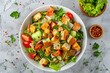Fattoush salad with fresh vegetables and dressing on gray background viewed from above