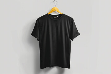 Blank black t-shirt mockup on a wooden hanger against a clean wall background