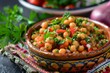 Moroccan style chickpea salad with vegetables and spicy olive dressing