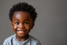 Joyful Black Boy With Bright Smile And Curly Hair