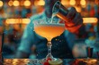 Bartender using tableware to pour drink into martini glass