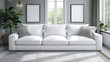 White sofa with cushions in bright living room, green plant adds touch of nature. Setting is ideal for modern interior design themes and comfortable living