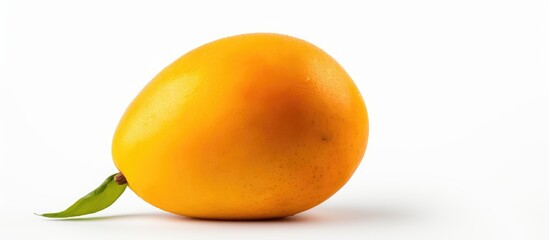 Poster - a ripe mango with a leaf on a white surface