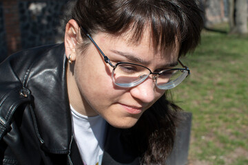 Wall Mural - Close up portrait of a young woman in red eyeglasses	