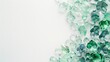 Abstract background with emerald, green glass flowers for decoration. Top view, copy space