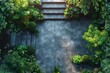 Overhead view of a garden with lush greenery and stairs