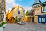 Fototapeta Uliczki - A picturesque medieval stone house in the historic La Cite' de Carcassonne, inside the fortified castle in Carcassonne, France.
