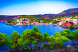 Assos, Kefalonia, Greece. Colorful houses and turquoise colored bay of a village on an idyllic Ionian island