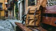 Brown hipster backpack on the bench in Spanish city old town square street. Solo traveler, tourism, travel, vacation concept