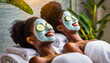 © Bill - Two women in a spa laying down with facial masks and cucumber slices on their eyes.