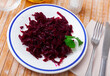 Delicious healthy salad of shredded boiled beets served with fresh greens..