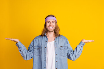 Sticker - Photo portrait of attractive young hippie man compare empty space wear trendy denim outfit isolated on yellow color background