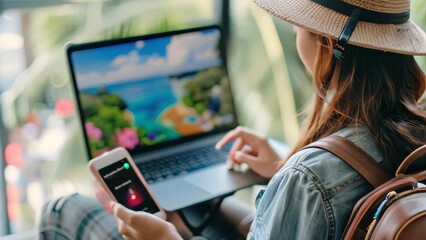 Man using a laptop and smartphone for tour reservation or booking online.