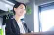 Image of a smiling woman in a meeting or business meeting saleswoman Image of real estate, consultant, etc.