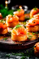 Poster - Salmon appetizer with dill in puff pastry on a wooden tray.