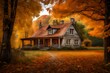 A charming cottage surrounded by trees in their full autumn splendor.