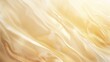 Close-up of golden satin draped elegantly, creating smooth waves. Wallpaper. Background.