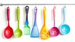 A set of colorful kitchen utensils, hanging neatly on a rack, each one a tool for culinary mastery. Isolated on pure white background.