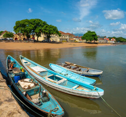 Poster - Small traditional fishing boats lining a dock in São Tomé, São Tomé and Principe (STP), Central Africa