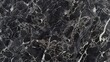 An elegant black marble surface with intricate grey and silver patterns, creating a sophisticated and luxurious feel for any design project.