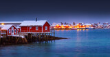 Fototapeta  - Scenic night lights of Lofoten islands, Norway, Reine and red houses in fishing village on a sea shore.