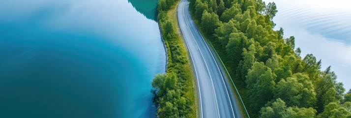 Canvas Print - Aerial Shot of Curvy Road Along Serene Lake