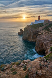 Fototapeta Natura - moody view on Cabo Sao Vicente with its famous lighthouse at sunset at the south.estern spit of Europe near Sagres, Algarve, Portugal