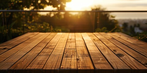 Wall Mural - A wooden table with the sun setting in the background. Perfect for outdoor and nature themed designs