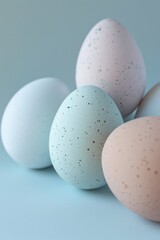 Poster - A group of eggs sitting on a blue surface. Ideal for food and cooking concepts