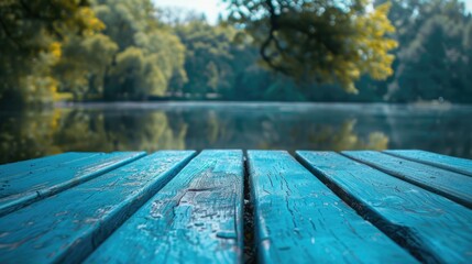 Poster - A close up of a wooden table near a body of water. Suitable for outdoor and nature themes