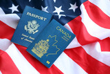 Fototapeta  - Passport of Canada with US Passport on United States of America folded flag close up