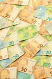 Fototapeta  - Many european euro money bills. Lot of banknotes of european union currency close up