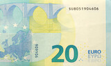 Fototapeta  - Fragment of one twenty euro money bill. Details of European union currency banknote of 20 euro close up