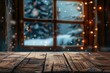 A wooden table in front of a window with twinkling Christmas lights. Ideal for holiday themed designs