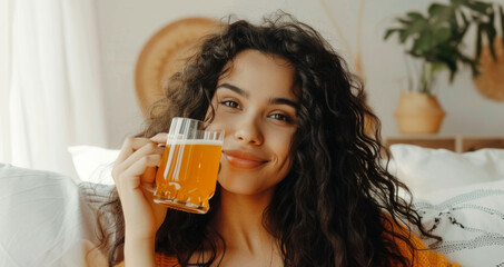 Happy and smiling young woman enjoying drinking Kombucha drink at modern home. Healthy natural probiotic drink. Generative ai