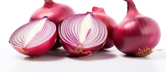 Three onions on a white surface