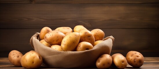 Poster - Sack of potatoes on rustic table