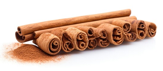 Aufkleber - Cinnamon sticks and ground spice on white backdrop