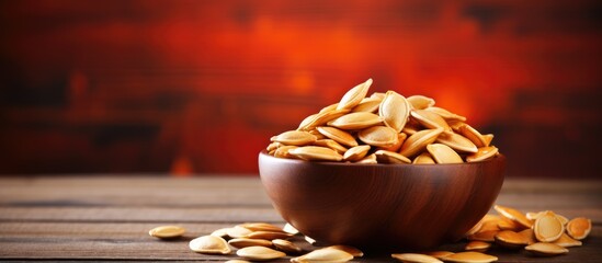 Leinwandbilder - Wooden bowl of peanuts on table