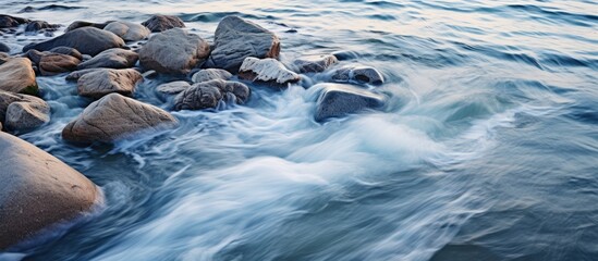 Aufkleber - Rocky shore with water flowing among large stones