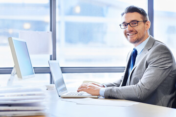 Canvas Print - Face, businessman and laptop in workplace for corporate company with email, documents and advice. Tech, executive and portrait of male lawyer in office with suit, web and expertise for legal client