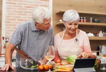 Canvas Print - Senior, couple and online, cooking and tablet for learning, videos and guide for diet and internet. House, old man and woman in kitchen, together and healthy food, champagne and meal prep with app